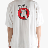 White t-shirt worn by a person, showing the shirt's fit