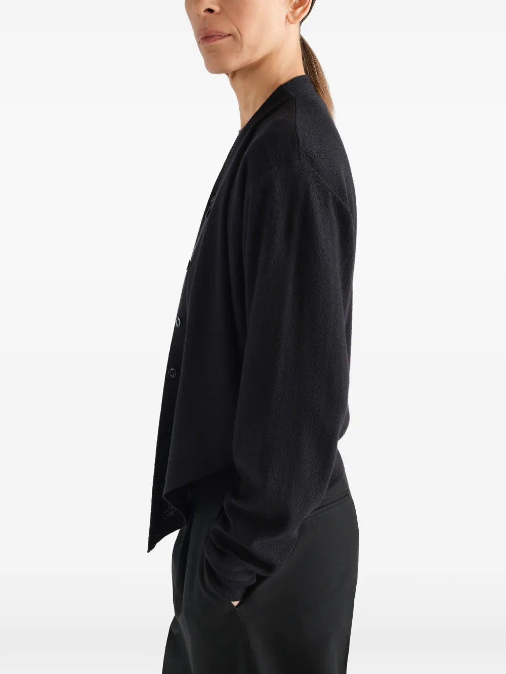 Black top worn by a person, showing the top fit