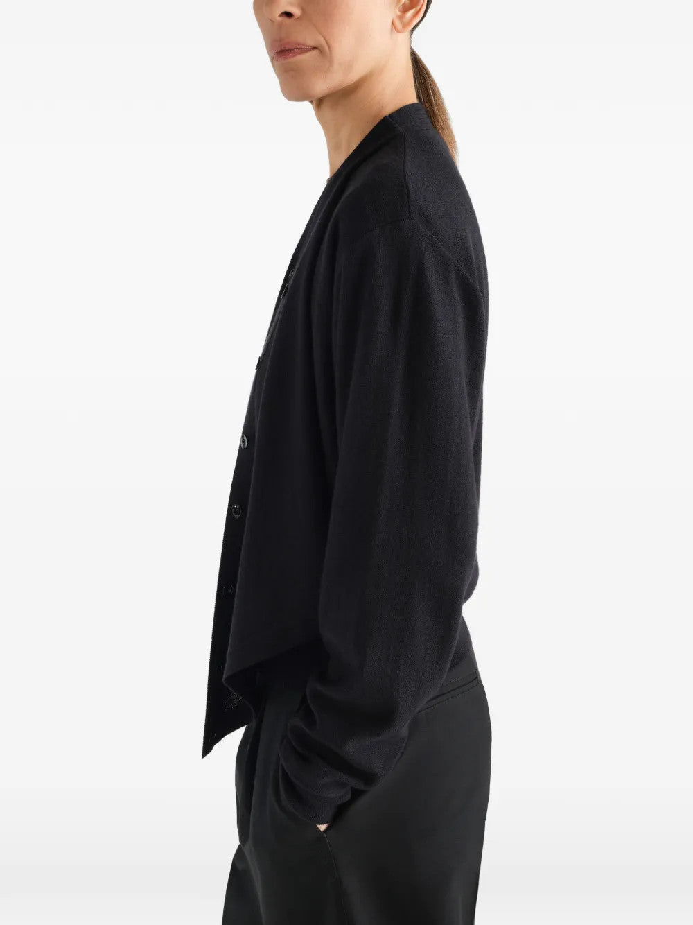 Black top worn by a person, showing the top fit