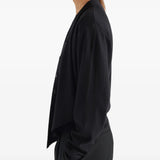 Black top worn by a person, showing the top fit