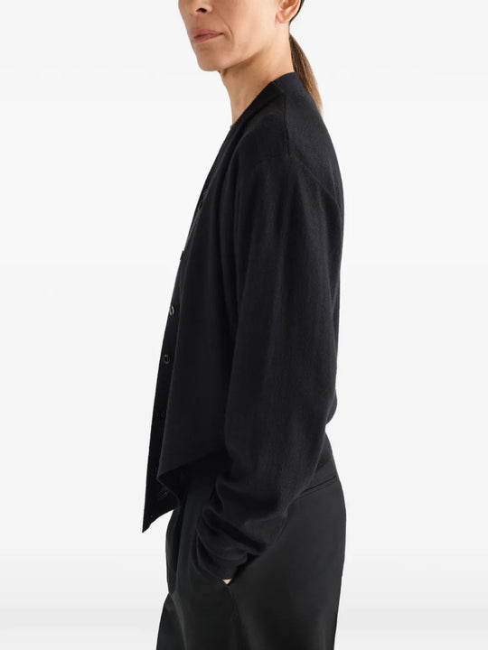 Black top worn by a person, showing the top fit