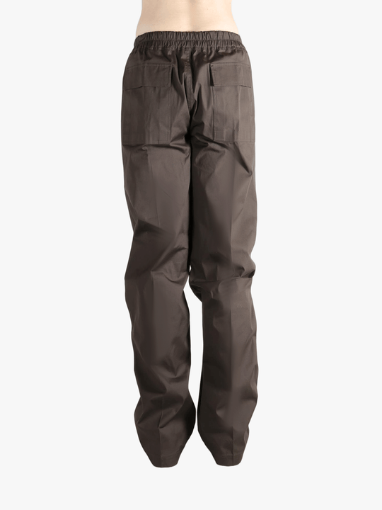 Brown pants worn by a person, showing the pants fit