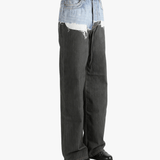 Black jeans worn by a person, showing the jeans fit