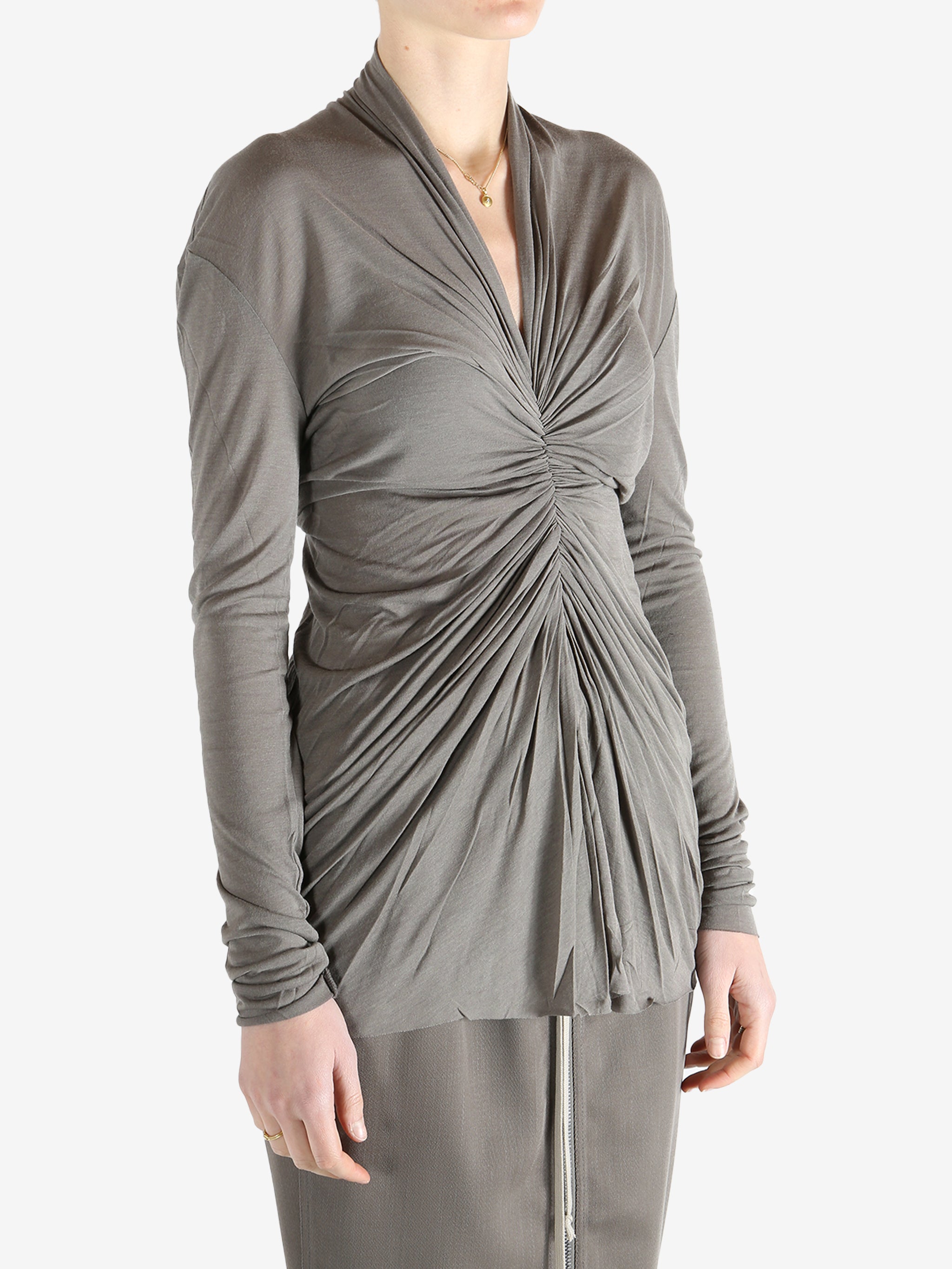 Grey t-shirt worn by a person, showing the t-shirt's fit