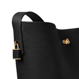 Close up of black bucket bag, showing texture of the Cow Leather fabric