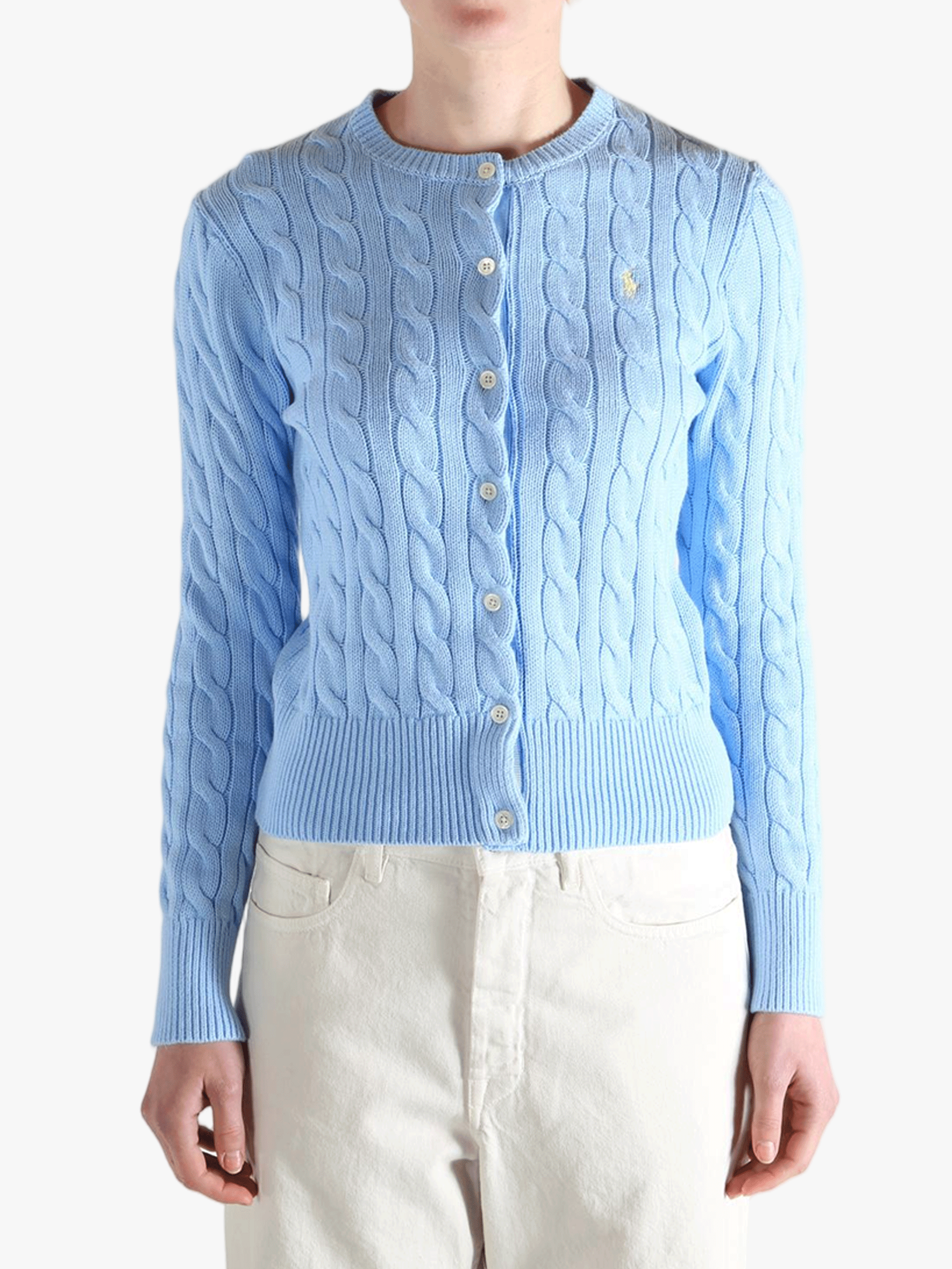 Blue knitwear worn by a person, showing the  knitwear's fit