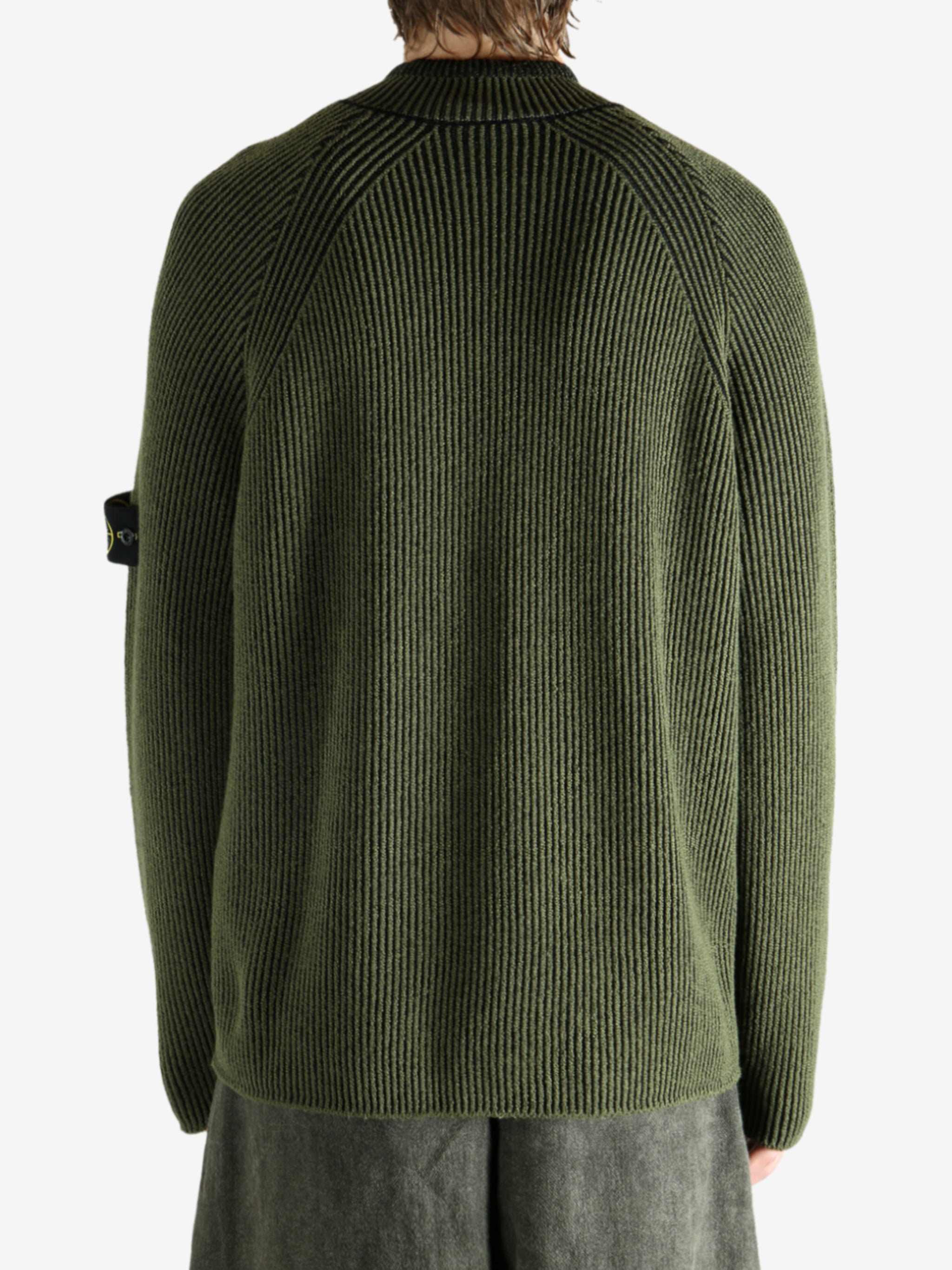 Green shirt worn by a person, showing the shirt's fit