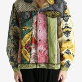 Green jacket worn by a person, showing the jacket‘s fit