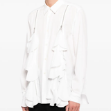 White shirt worn by a person, showing the shirt fit