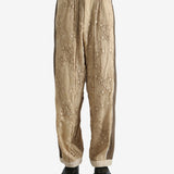 Tan pants worn by a person, showing the pants fit