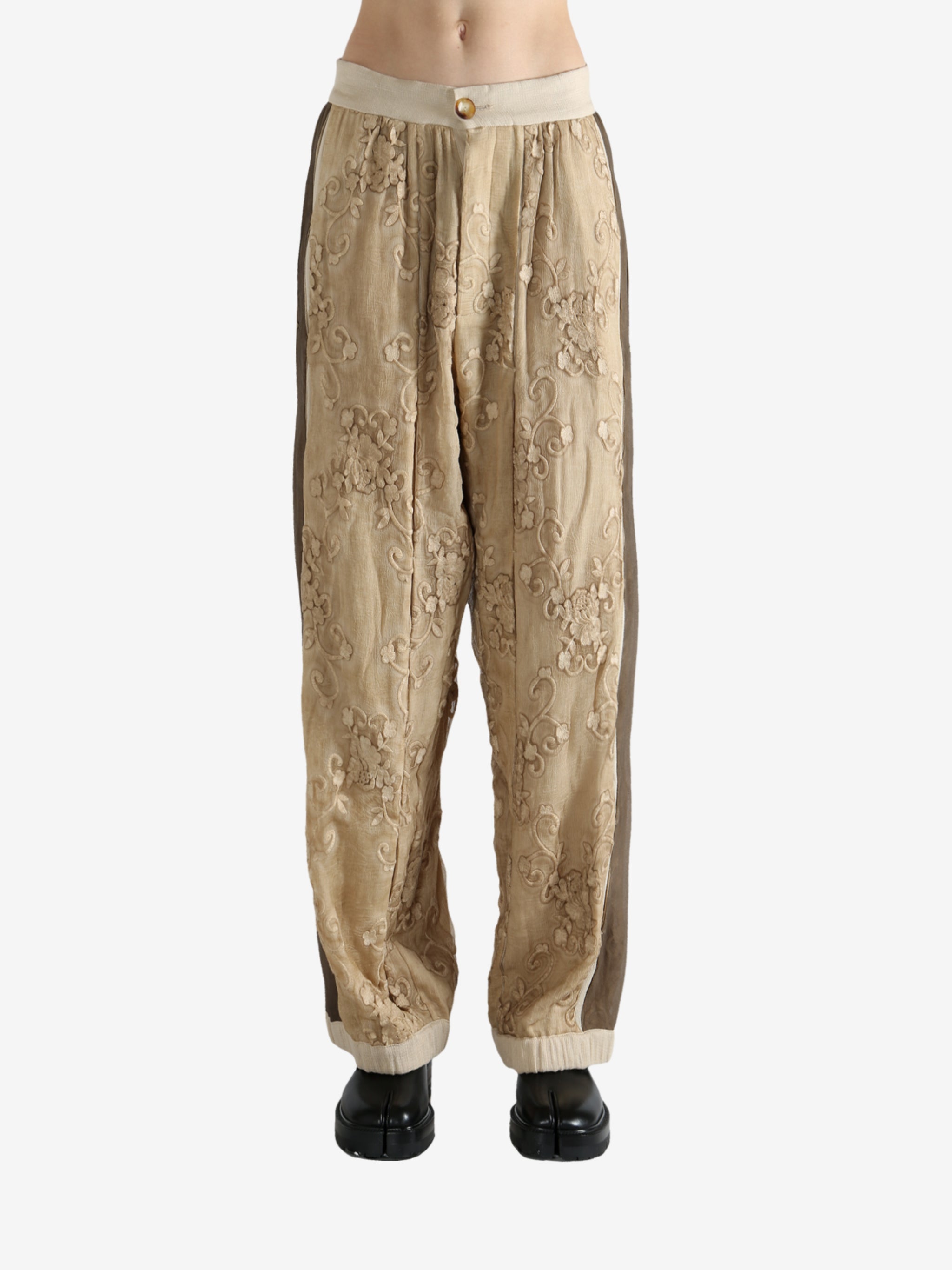 Tan pants worn by a person, showing the pants fit