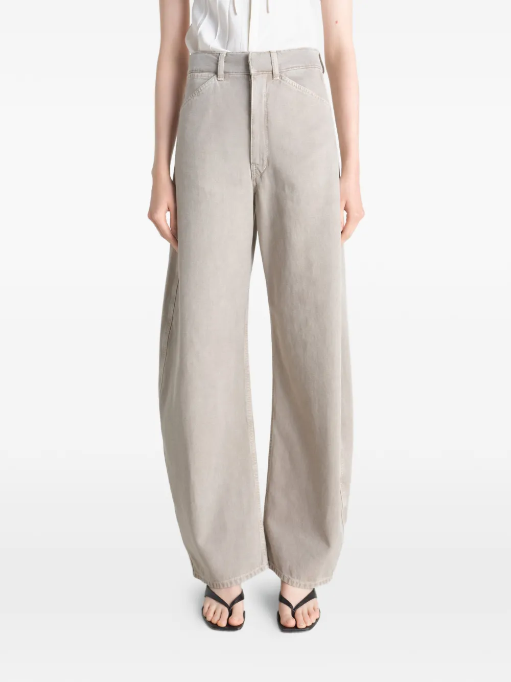 Grey pant worn by a person, showing the pant's fit