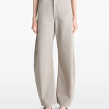 Grey pant worn by a person, showing the pant's fit