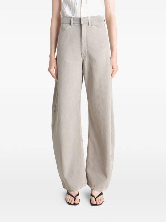 Grey pant worn by a person, showing the pant's fit