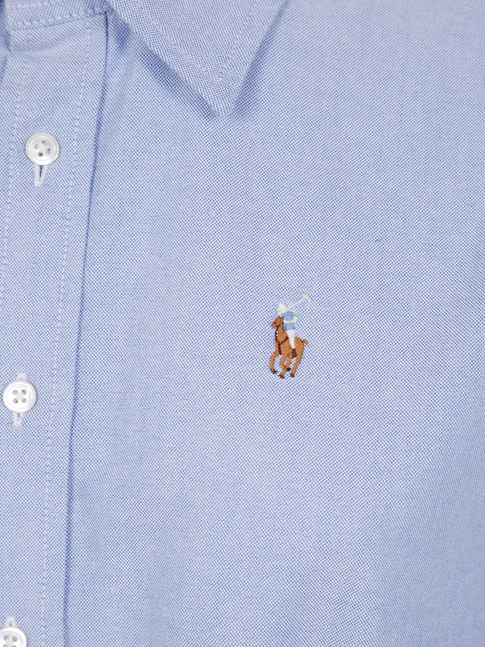 Close up of blue shirtdress, showing Polo Pony motif