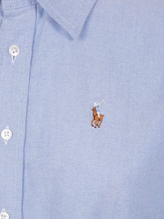Close up of blue shirtdress, showing Polo Pony motif