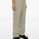 Green pants worn by a person, showing the pants's fit