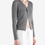 Grey knitwear worn by a person, showing the knitwear fit