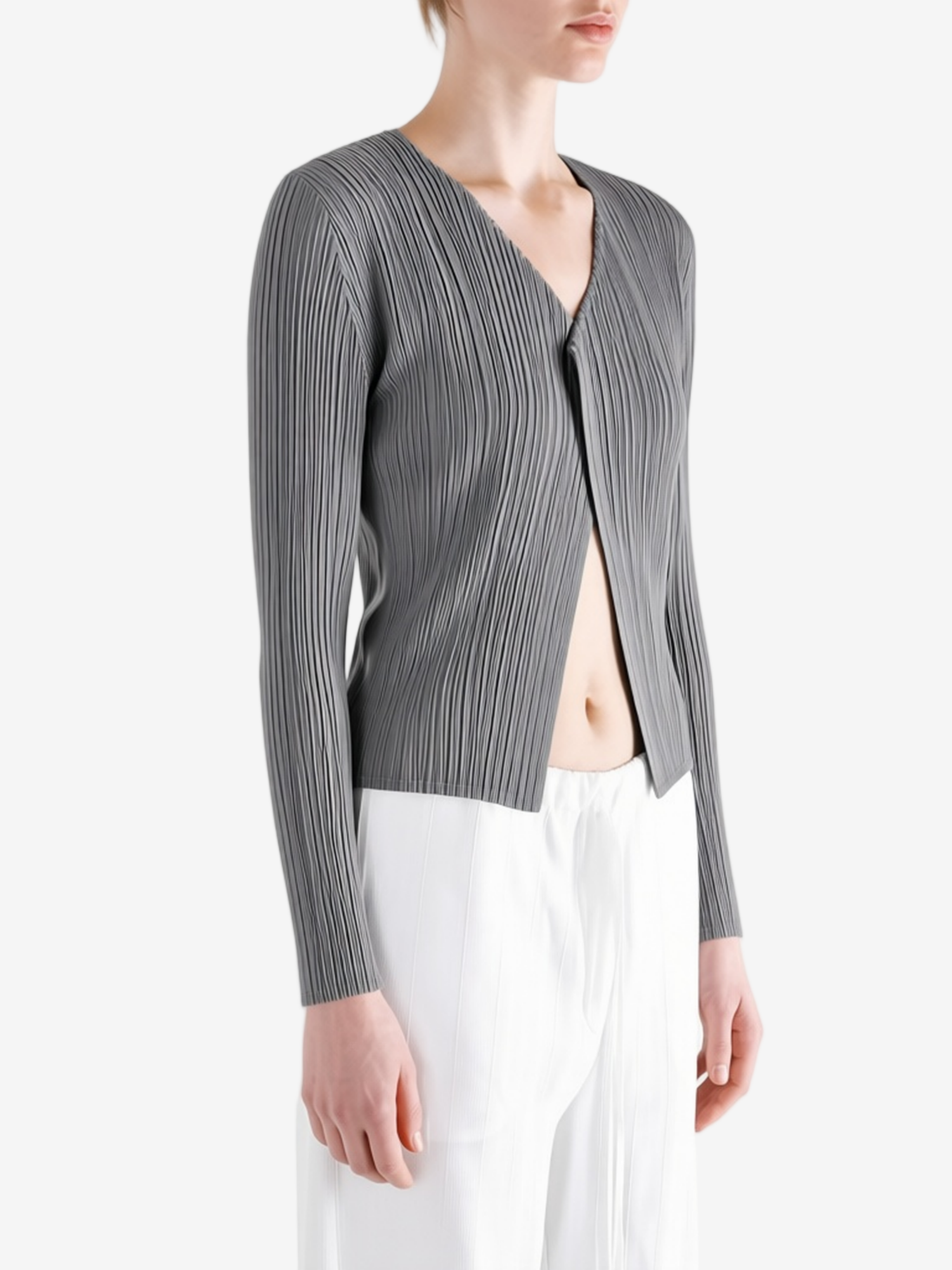 Grey knitwear worn by a person, showing the knitwear fit