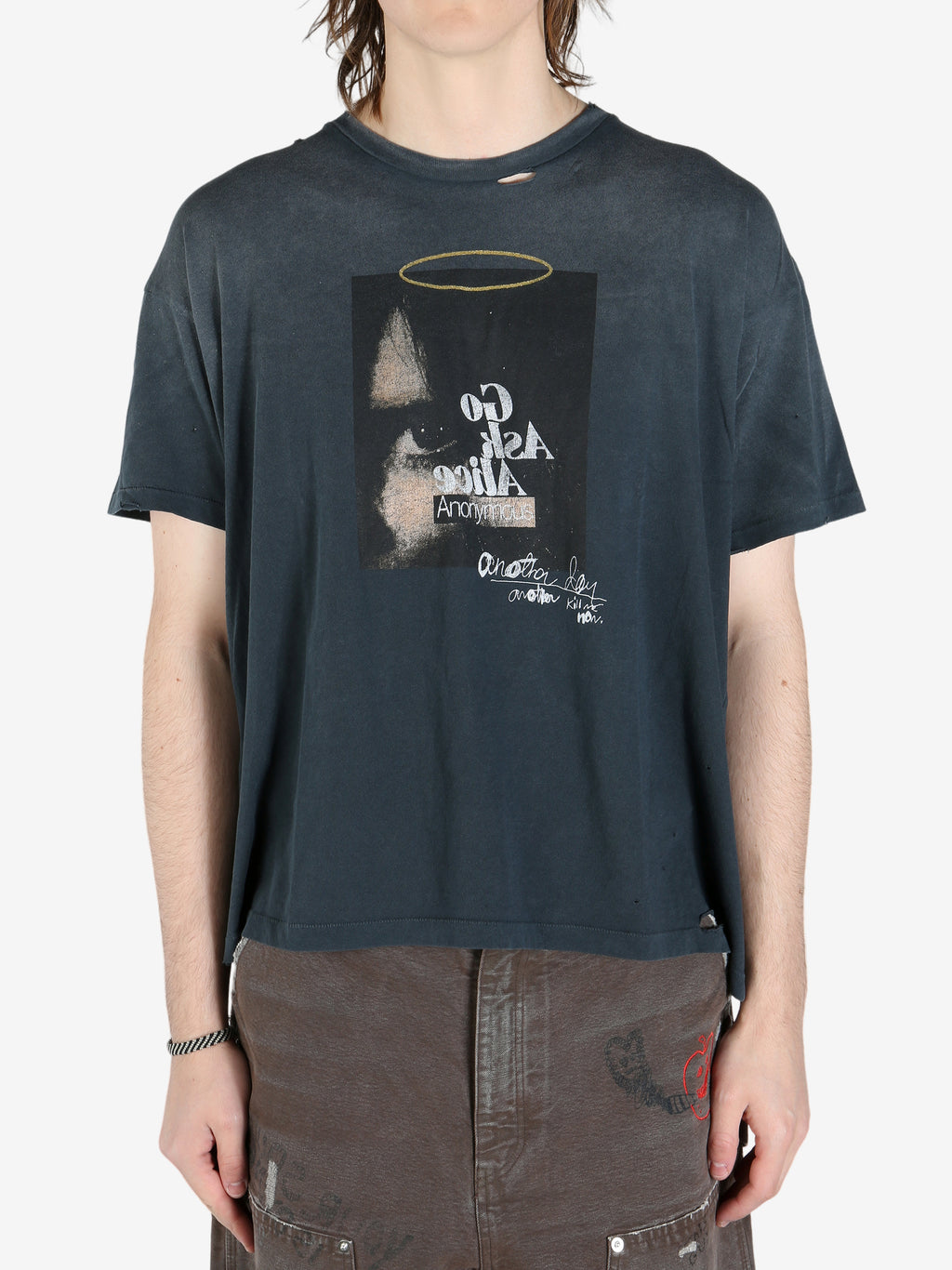 Black shirts worn by a person, showing the shirt's fit