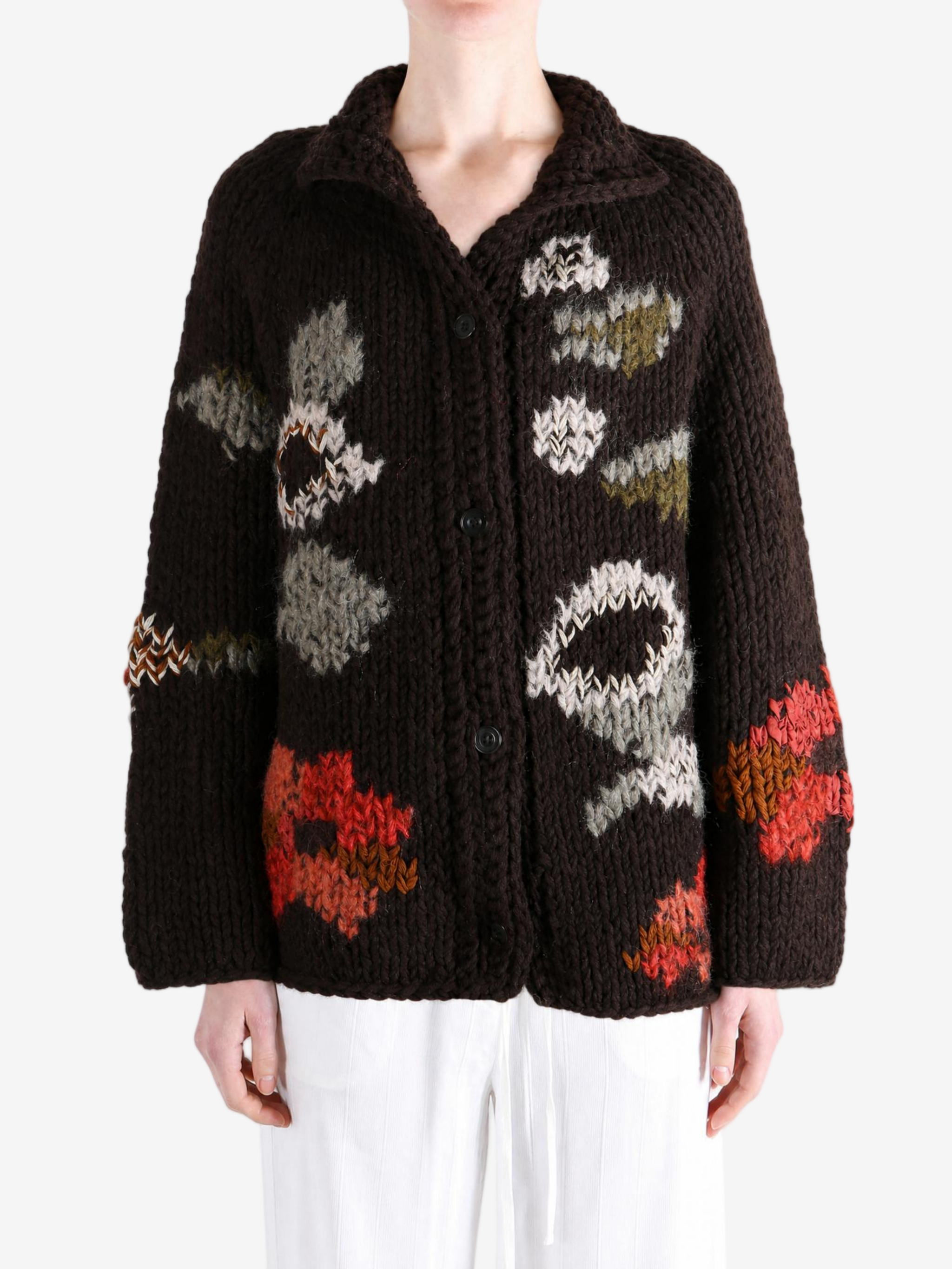 Brown knitwear worn by a person, showing the knitwear fit