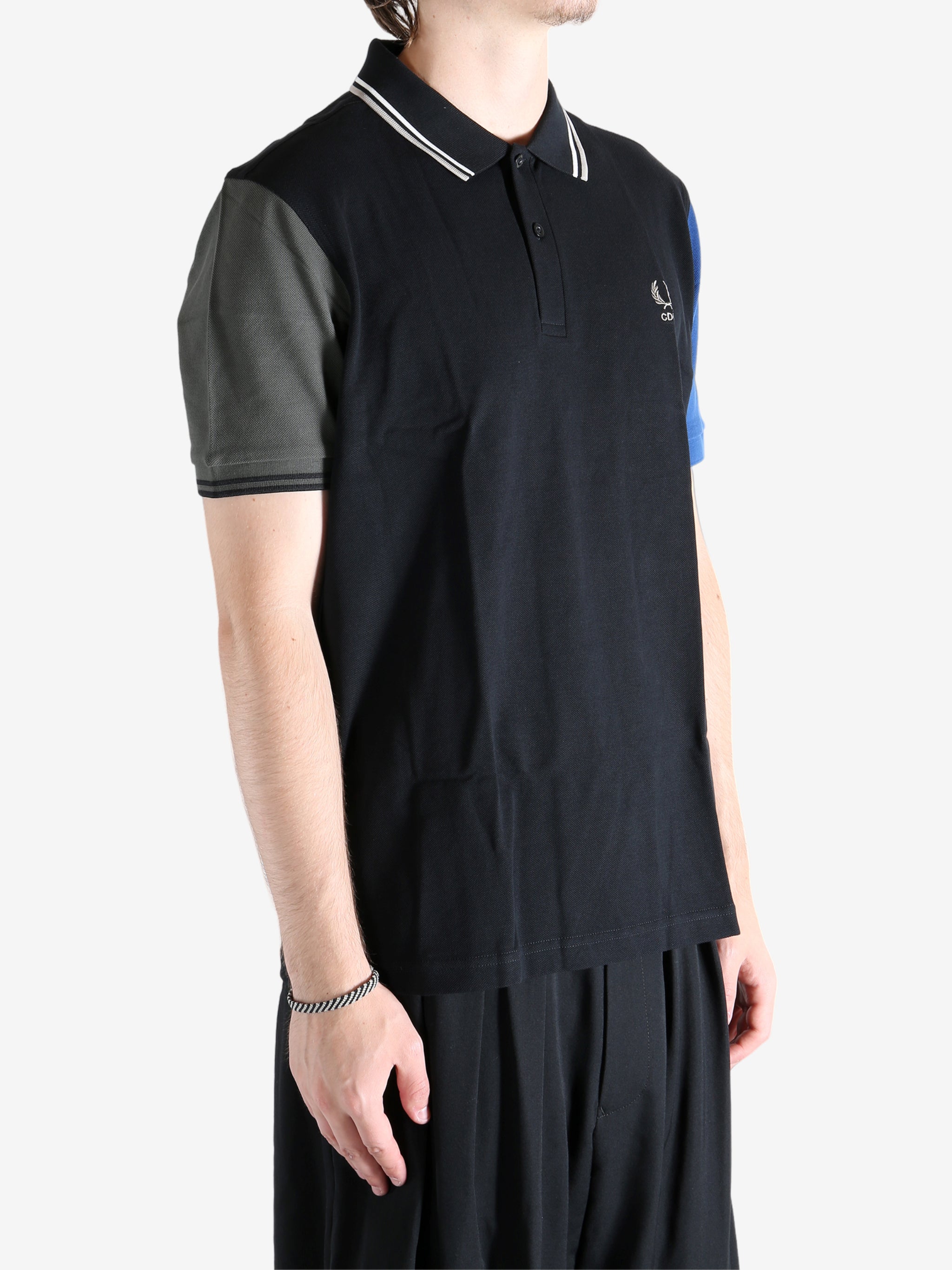 Black T-shirt worn by a person, showing the T-shirt's fit