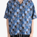 Navy shirt worn by a person, showing the shirt's fit