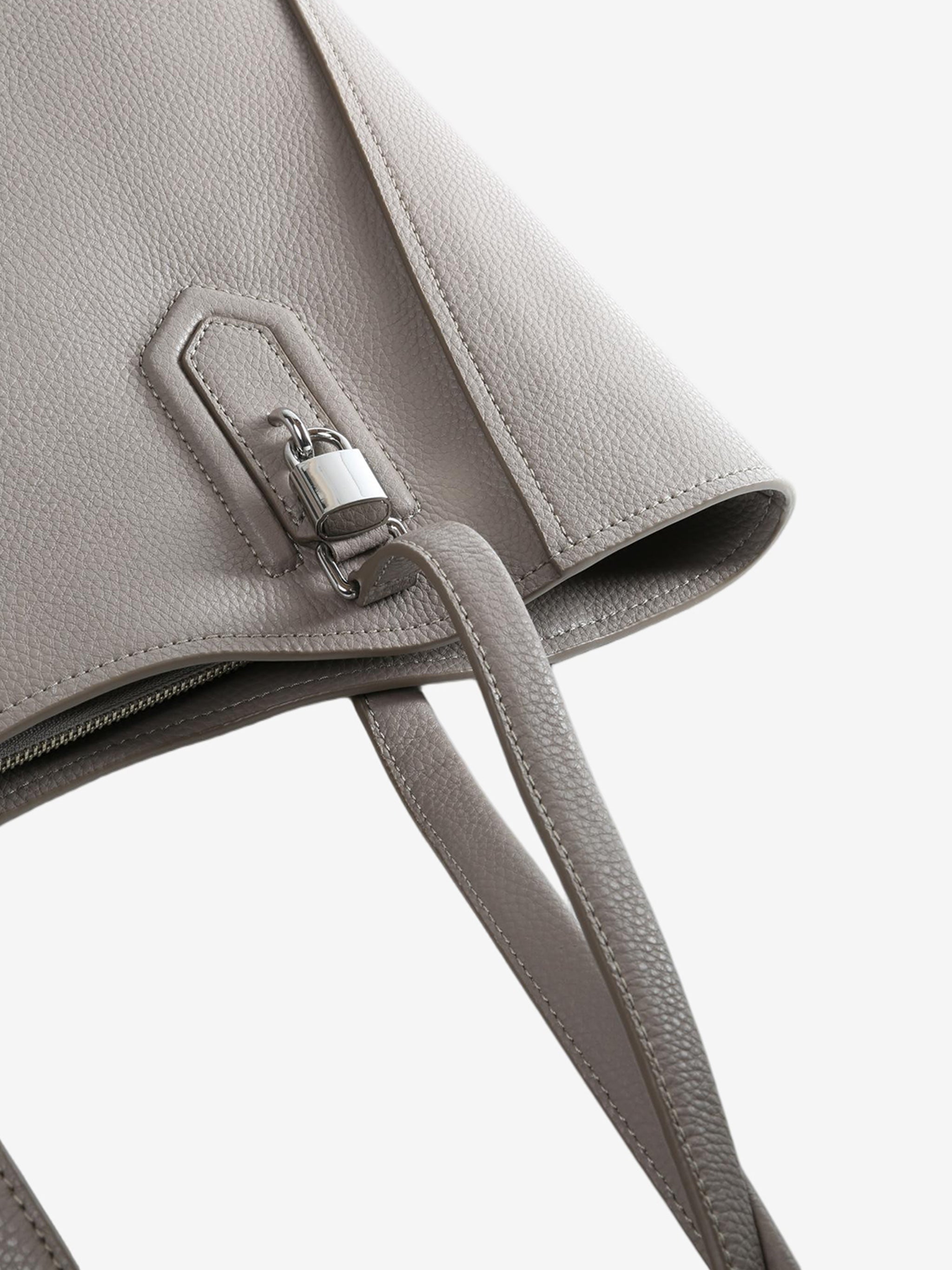 Close up of brown bag, showing texture of the leather fabric