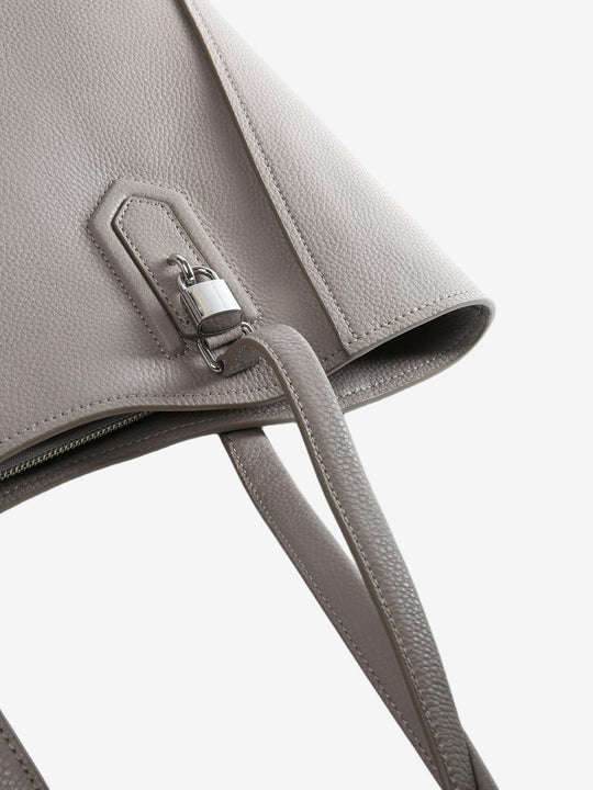 Close up of brown bag, showing texture of the leather fabric