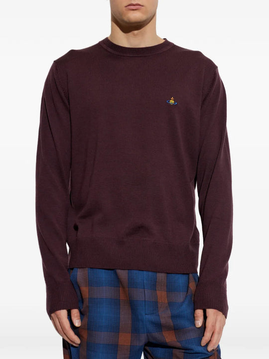 Burgundy hoodie worn by a person, showing the hoodie fit