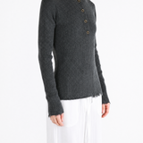 Grey top worn by a person, showing the top fit