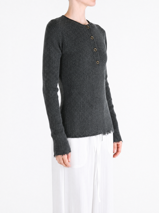 Grey top worn by a person, showing the top fit