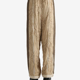 Tan pants worn by a person, showing the pants fit