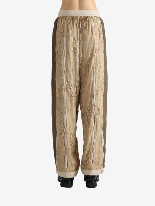 Tan pants worn by a person, showing the pants fit