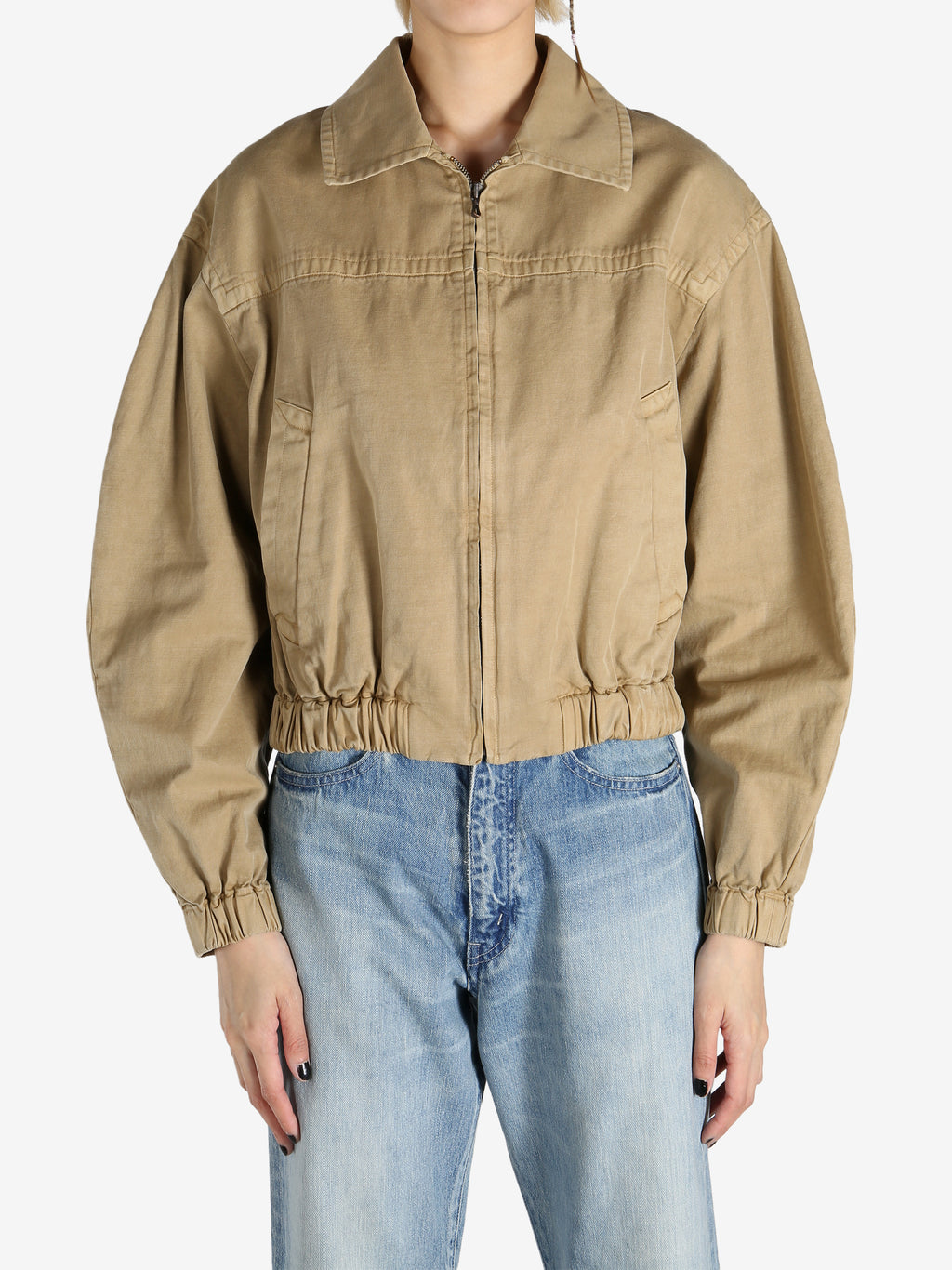 Tan jacket worn by a person, showing the jacket's fit