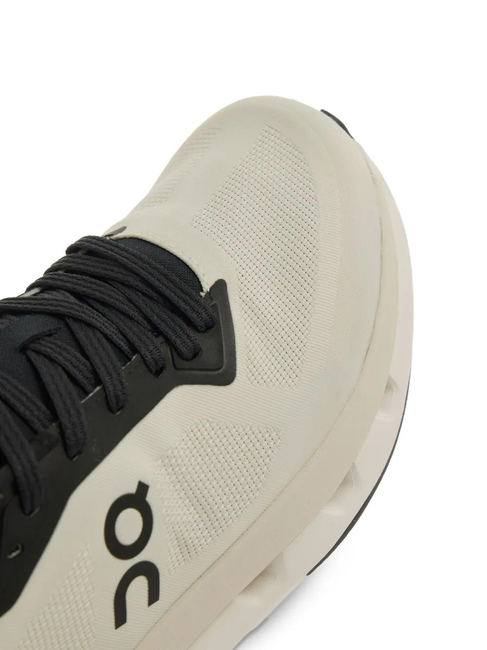 close up of white sneakers, showing texture of the recycled polyester fabric