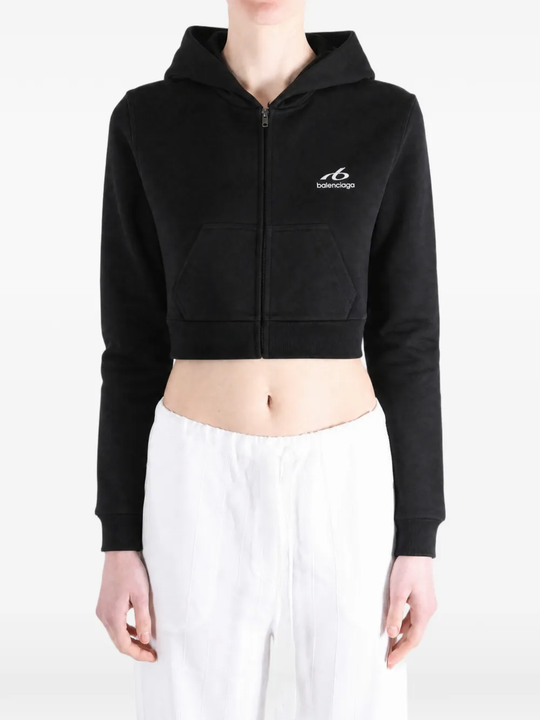 Black hoodie worn by a person, showing the hoodie's fit