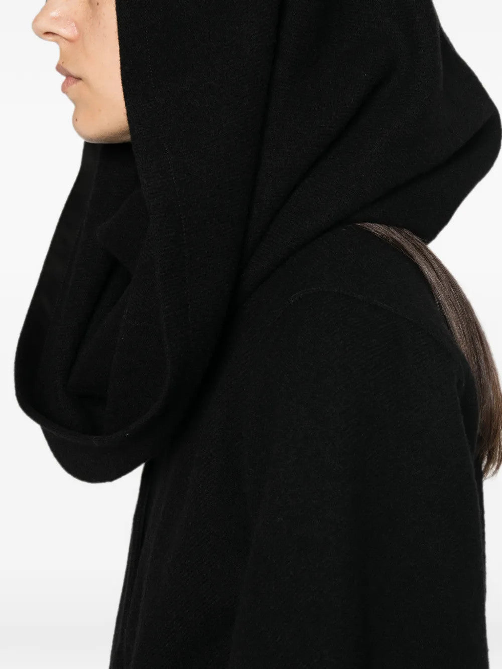 Black jacket worn by a person, showing the jacket fit