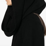 Black jacket worn by a person, showing the jacket fit