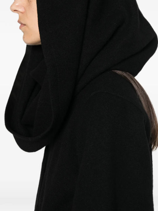 Black jacket worn by a person, showing the jacket fit