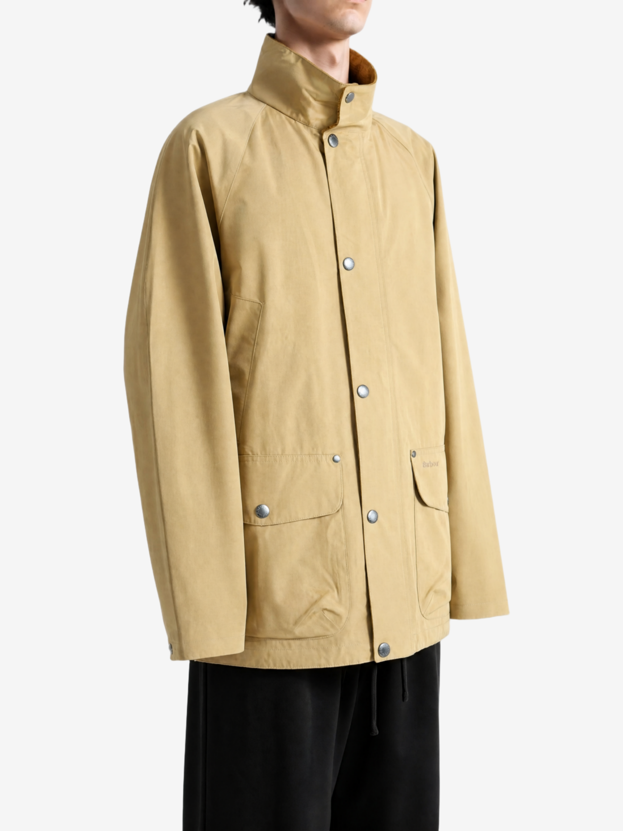 Tan jacket worn by a person, showing the jacket fit