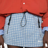 Blue skirt worn by a person, showing the skirt fit