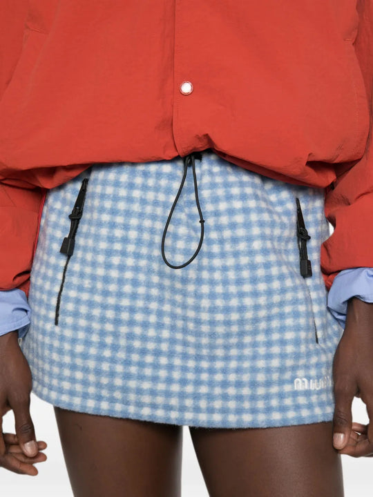 Blue skirt worn by a person, showing the skirt fit
