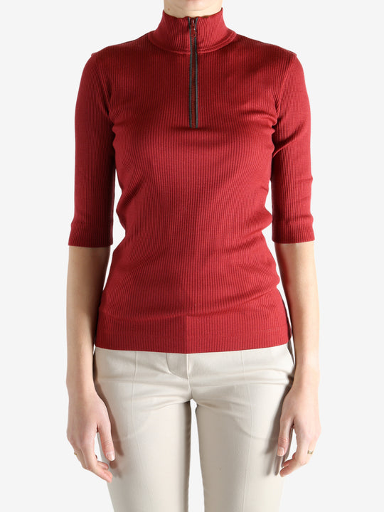 Red shirts worn by a person, showing the shirts fit