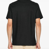Black t-shirt worn by a person, showing the t-shirt fit