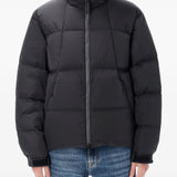 Black jackets worn by a person, showing the jackets fit