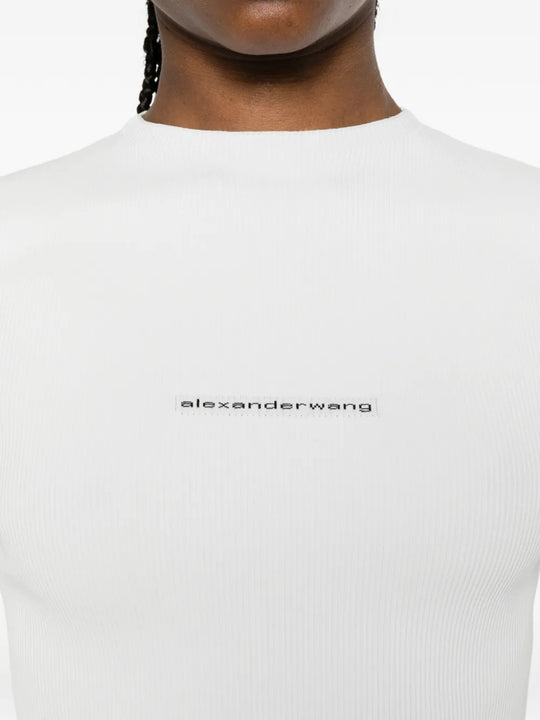 White top worn by a person, showing the top fit
