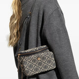 Navy bag carried by a person, showing the bag's fit