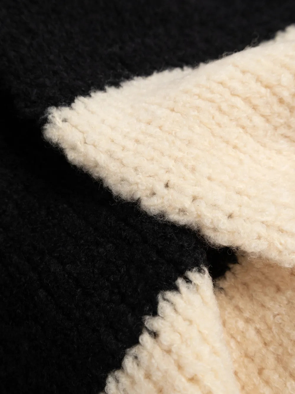 Close up of Tan scarf, showing texture of the 84% wool/ 16% polyamide fabric