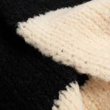 Close up of Tan scarf, showing texture of the 84% wool/ 16% polyamide fabric